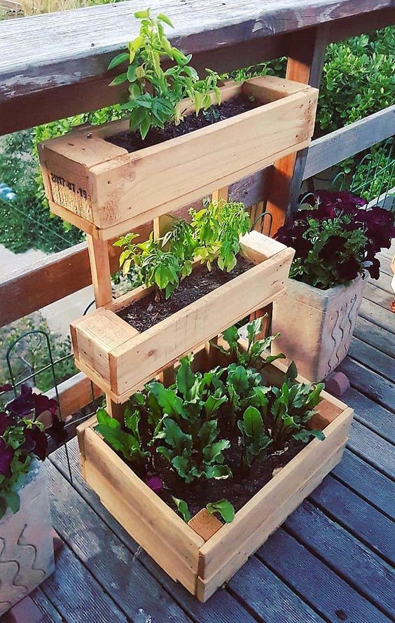 Decoration with DIY wooden pots and flower boxes that giving the garden ...